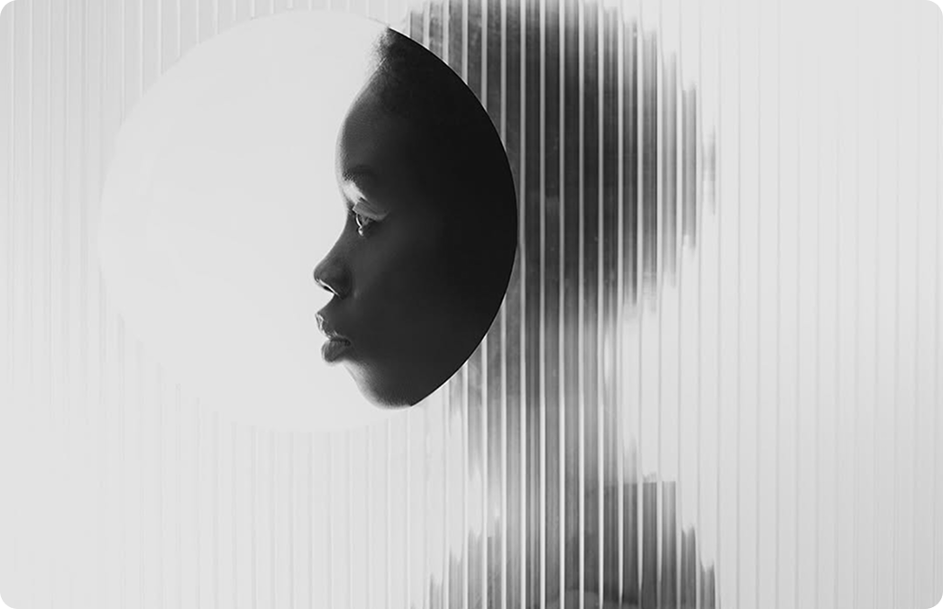 A profile portrait behind vertical linear distortion