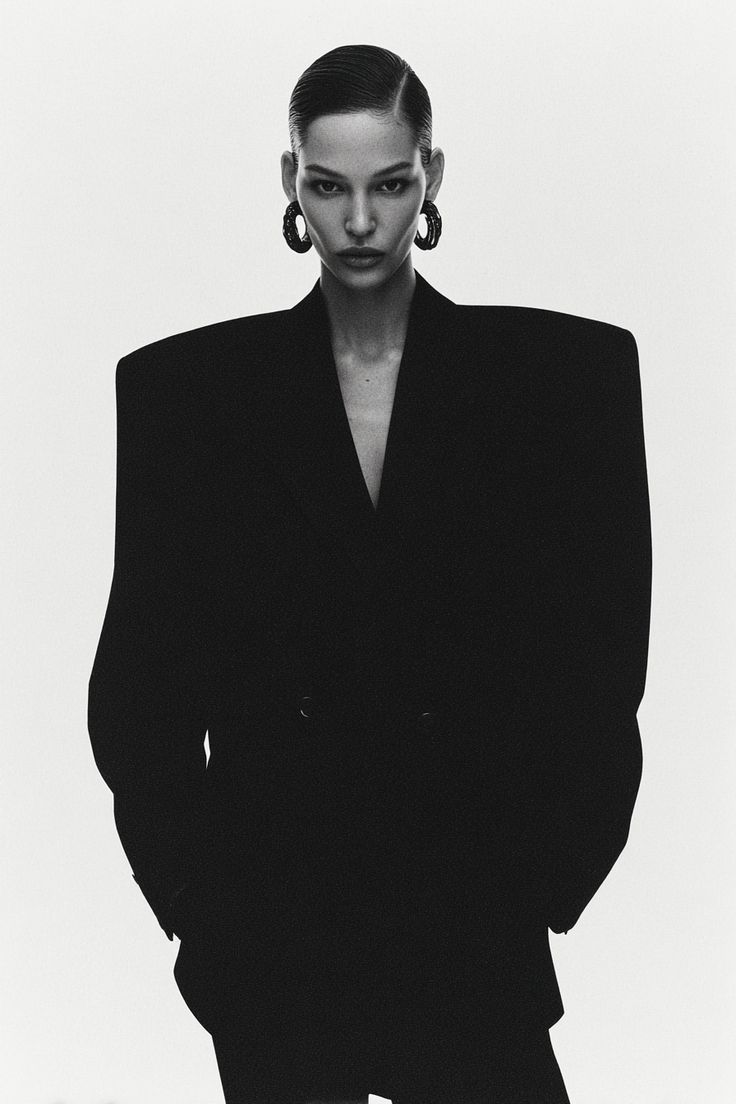 A portrait in profile against a pale background